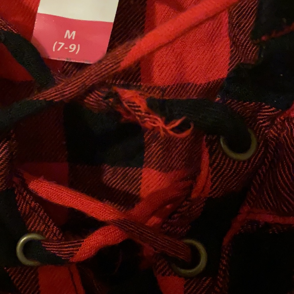 A red and black tank top with cross string over chest - Picture 5 of 7